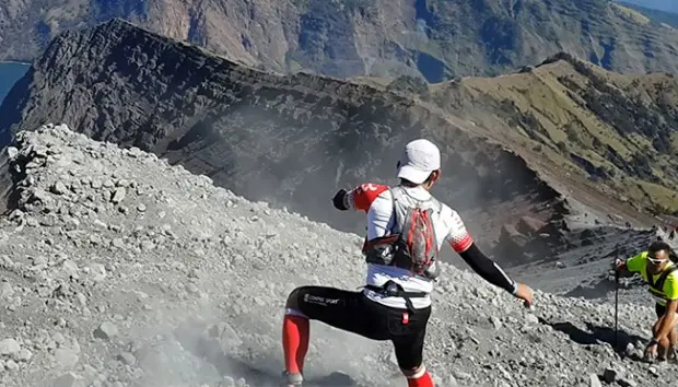 Runners competing in the Rinjani 100 ultra trail race on Mount Rinjani